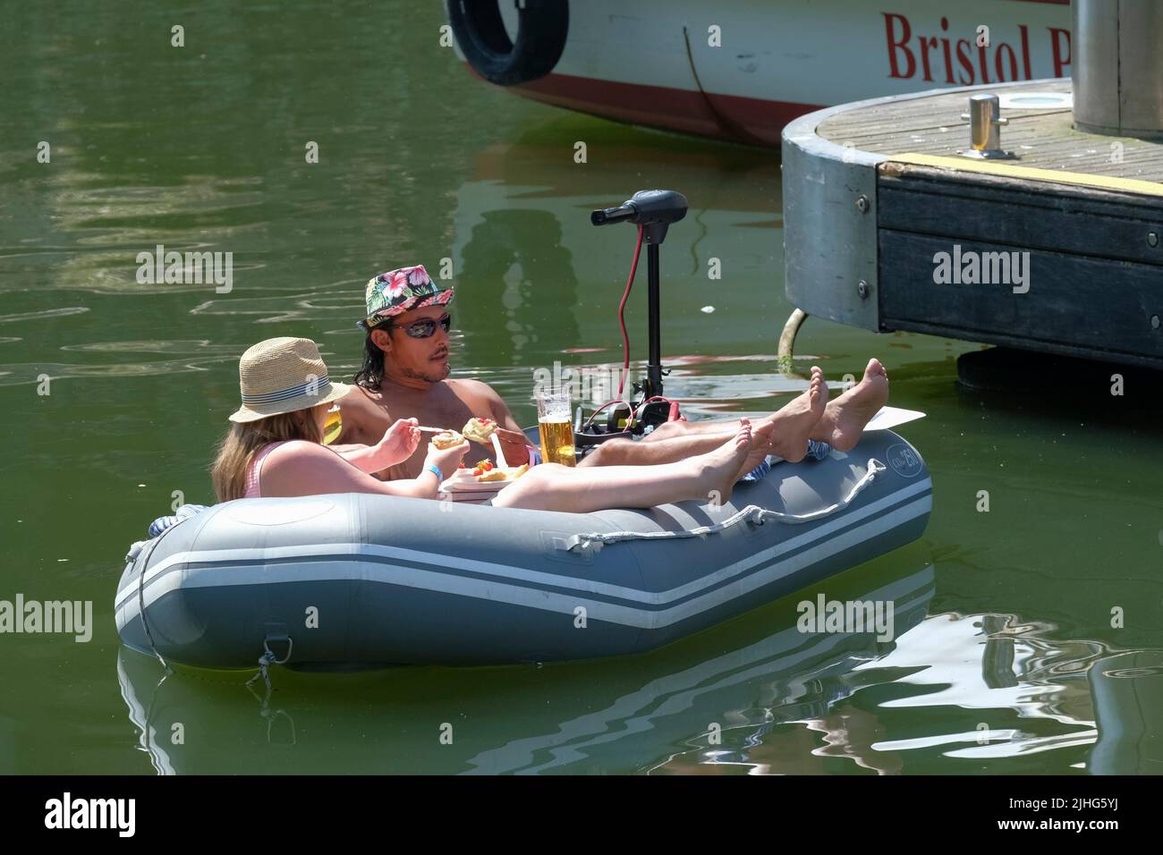 A couple enjoy a Cream tea in an inflatable at Bristol Harbour festival, Bristol UK Stock Photo