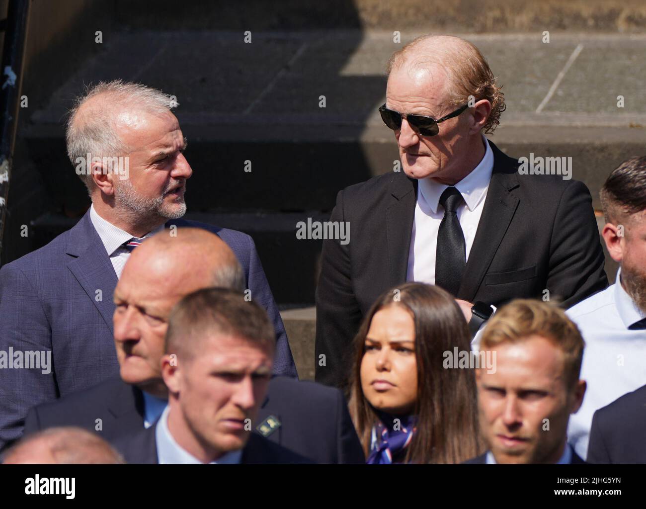 Former Rangers players Fraser Wishart (left) and Colin Hendry leave the church after of the funeral service of former Rangers goalkeeper Andy Goram, held at the Wellington Church, Glasgow. Goram who made 260 appearances for Rangers between 1991 and 1998, where he was simply known as 'The Goalie', died at the age of 58 on Saturday July 2, 2022. Picture date: Monday July 18, 2022. Stock Photo