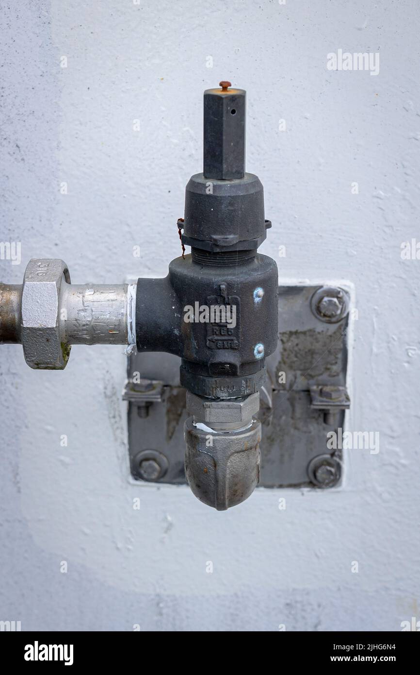 An industrial pressure safety valve, abbreviated as 'psv' a well-known concept in the industry. Specially made to prevent dangerous high pressures in Stock Photo