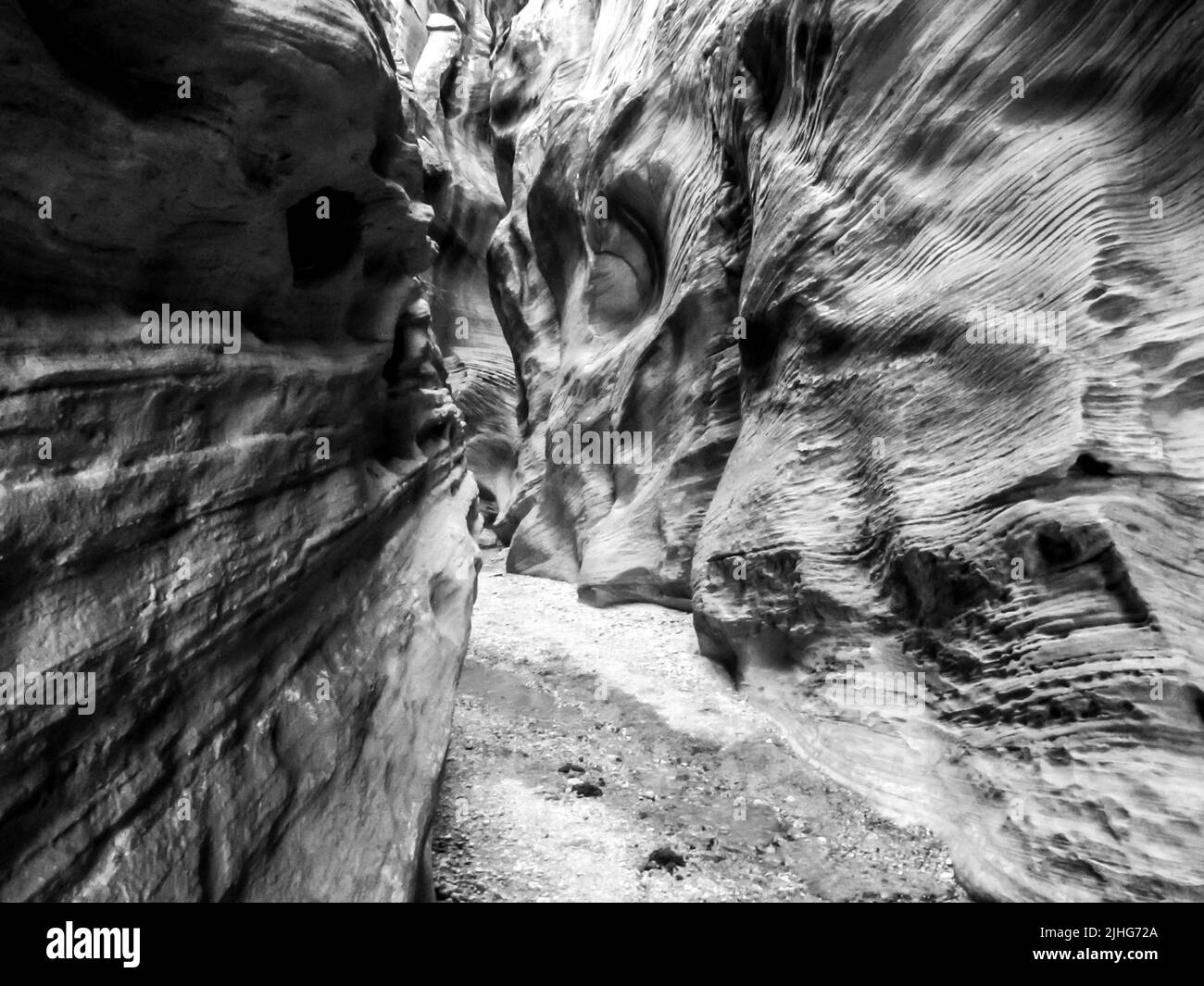 Black and White view of a narrow, confined Slot Canyon in the Grand Staircase-Escalante National Monument Stock Photo