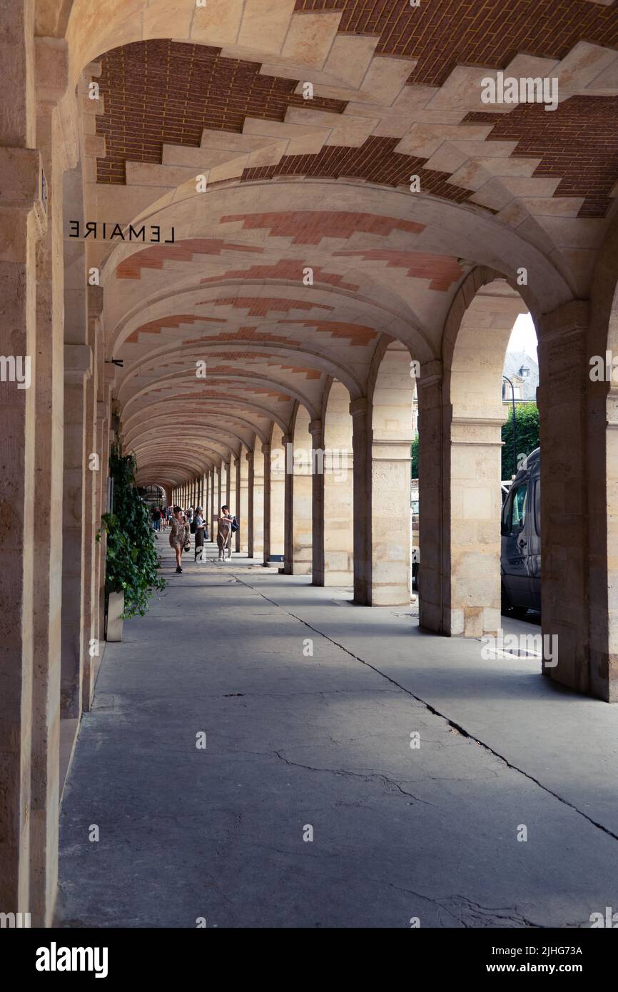 The arches of Place des Vosges is one of the oldest squares in Paris. Place des Vosges, France Stock Photo