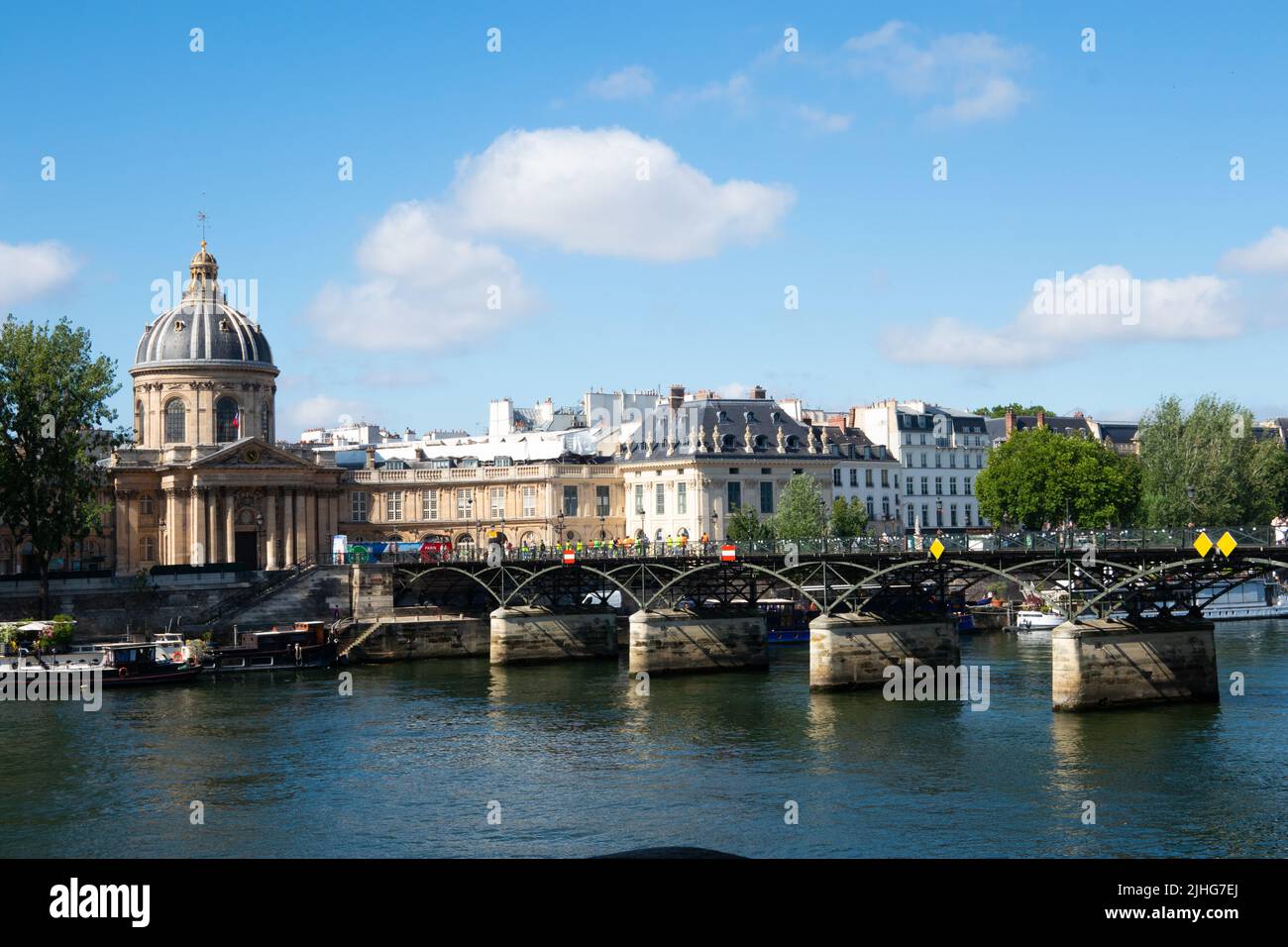 Pont des Arts or Passerelle des Arts is a pedestrian bridge with the dome of Institut de France Paris France Stock Photo