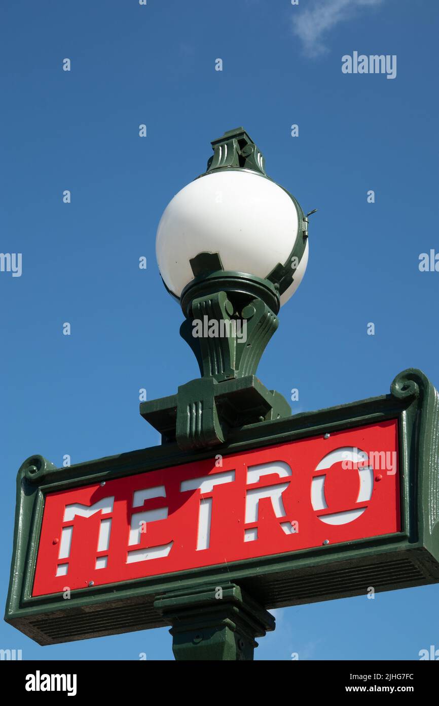 Red Metro sign again a clear blue sky. Paris France Stock Photo
