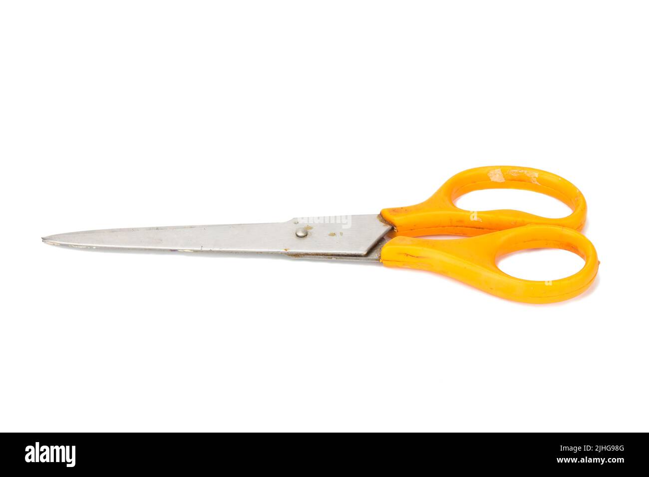 orange scissors. dirty. isolated no white background. Stock Photo