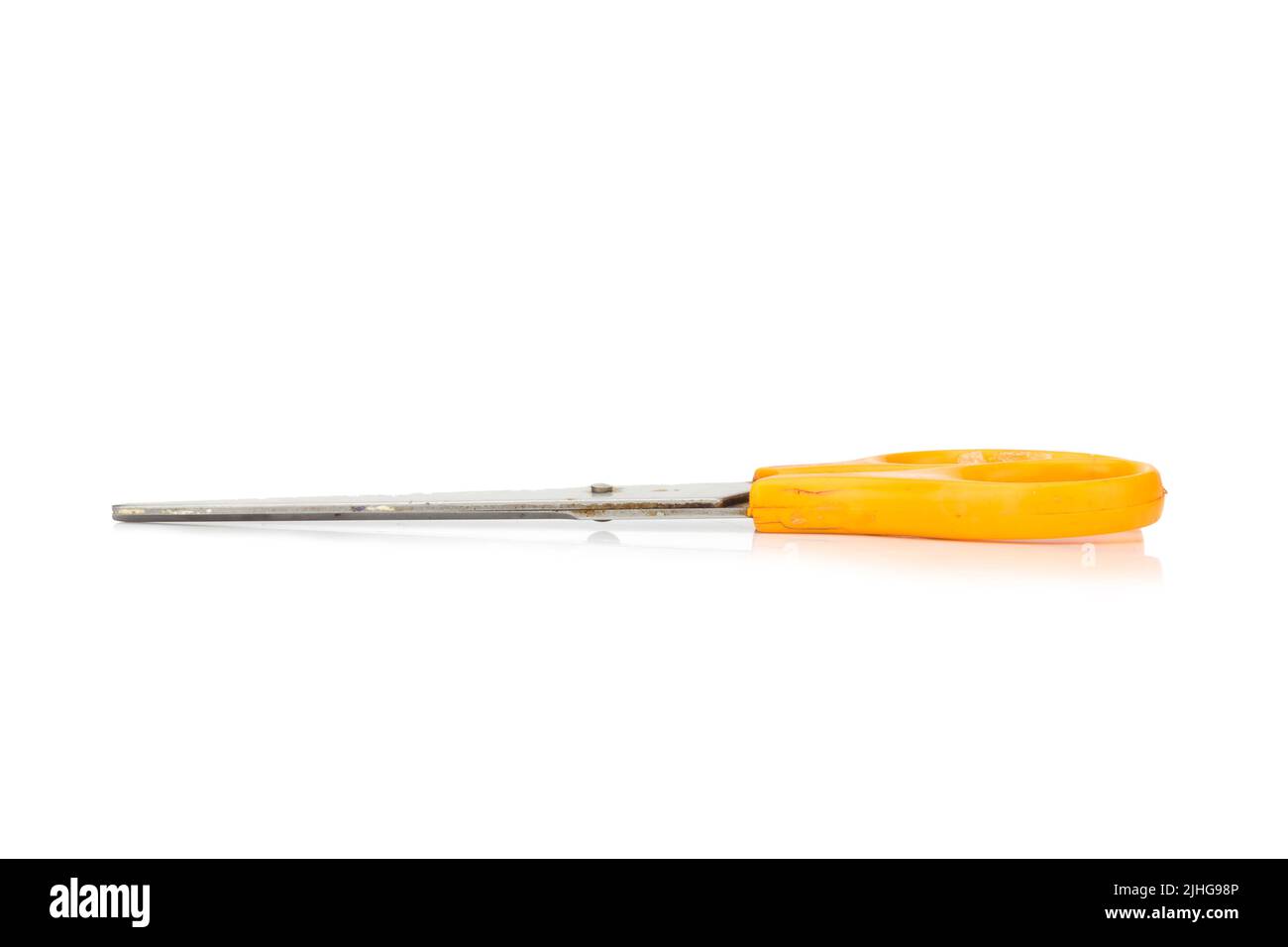 orange scissors. dirty. isolated no white background. Stock Photo