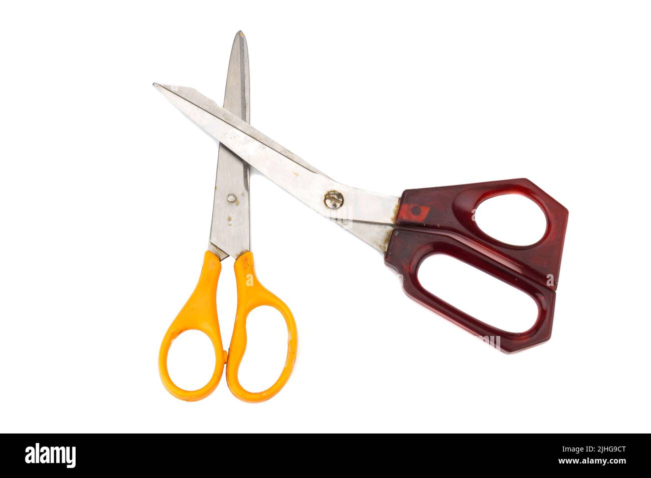 orange and red scissors. dirty. isolated on white background. Stock Photo