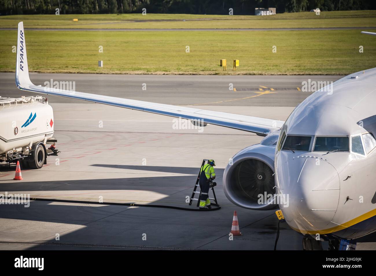 Wroclaw, Poland - August 2020 : Technician looking at the engine of Ryanair plane at Wroclaw airport Stock Photo