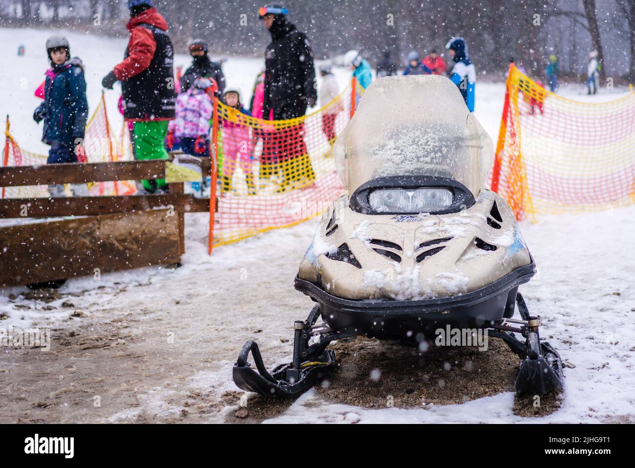 Szklarska Poreba, Poland - February 2020 : Snowmobile parked next to ski slope in winter Stock Photo