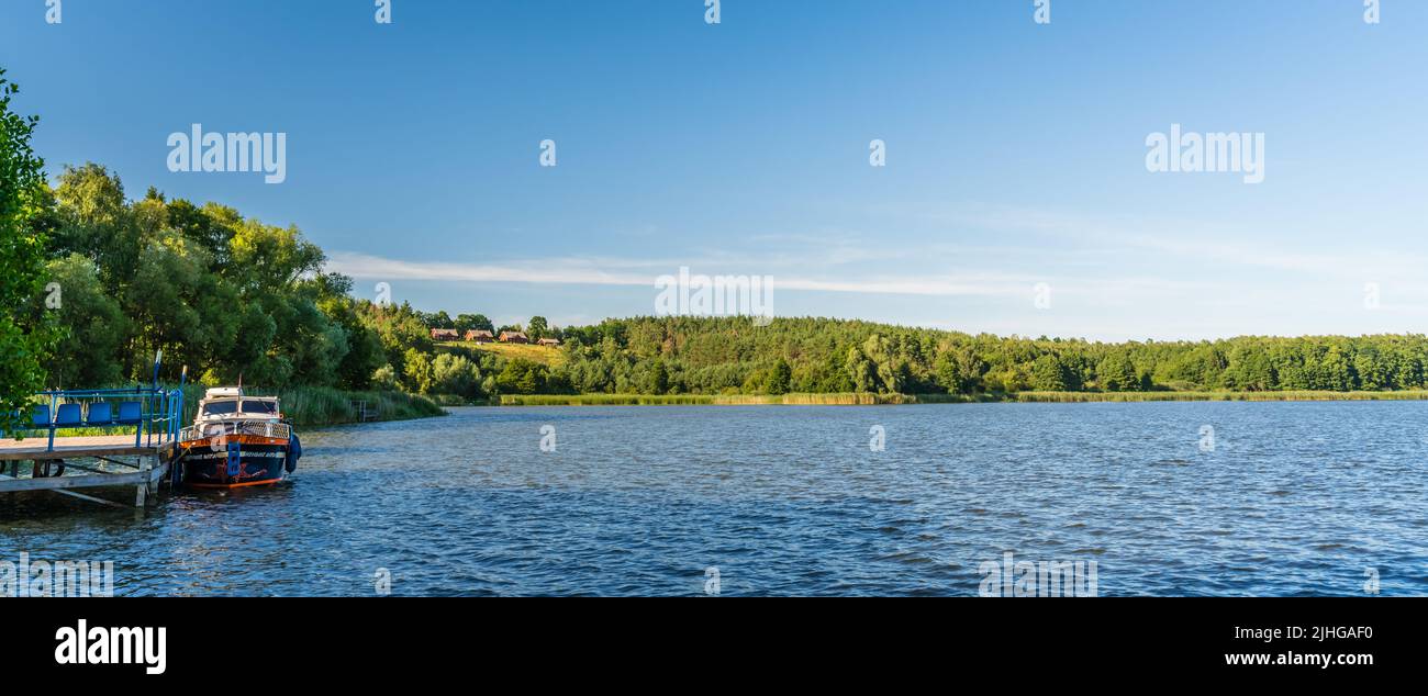 Jezioro Ostrowieckie, Poland - July 2020 : Private Boat landing and pier on a boat on Jezioro Ostrowieckie Stock Photo