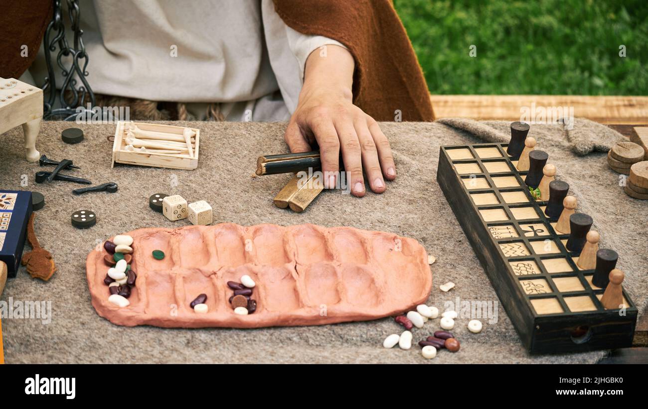 Senet and kalah game, popular in ancient Roman. Reconstruction of board games from the Roman Empire Stock Photo