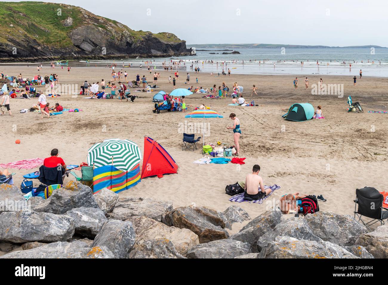 Rosscarbery, West Cork, Ireland. 18th July, 2022. Temperatures hit 28C at The Warren Beach in West Cork today. Tourists and locals flooded to the beach to make the most of the hot weather. Credit: AG News/Alamy Live News Stock Photo