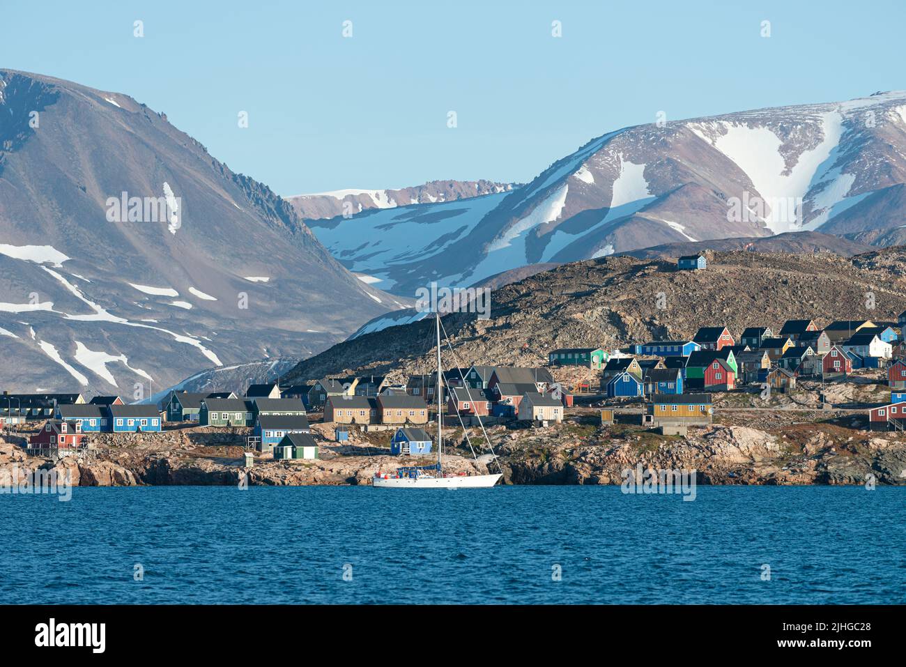Sailing boats moored in the bay at Ittoqqortoormiit in east Greenland. Stock Photo