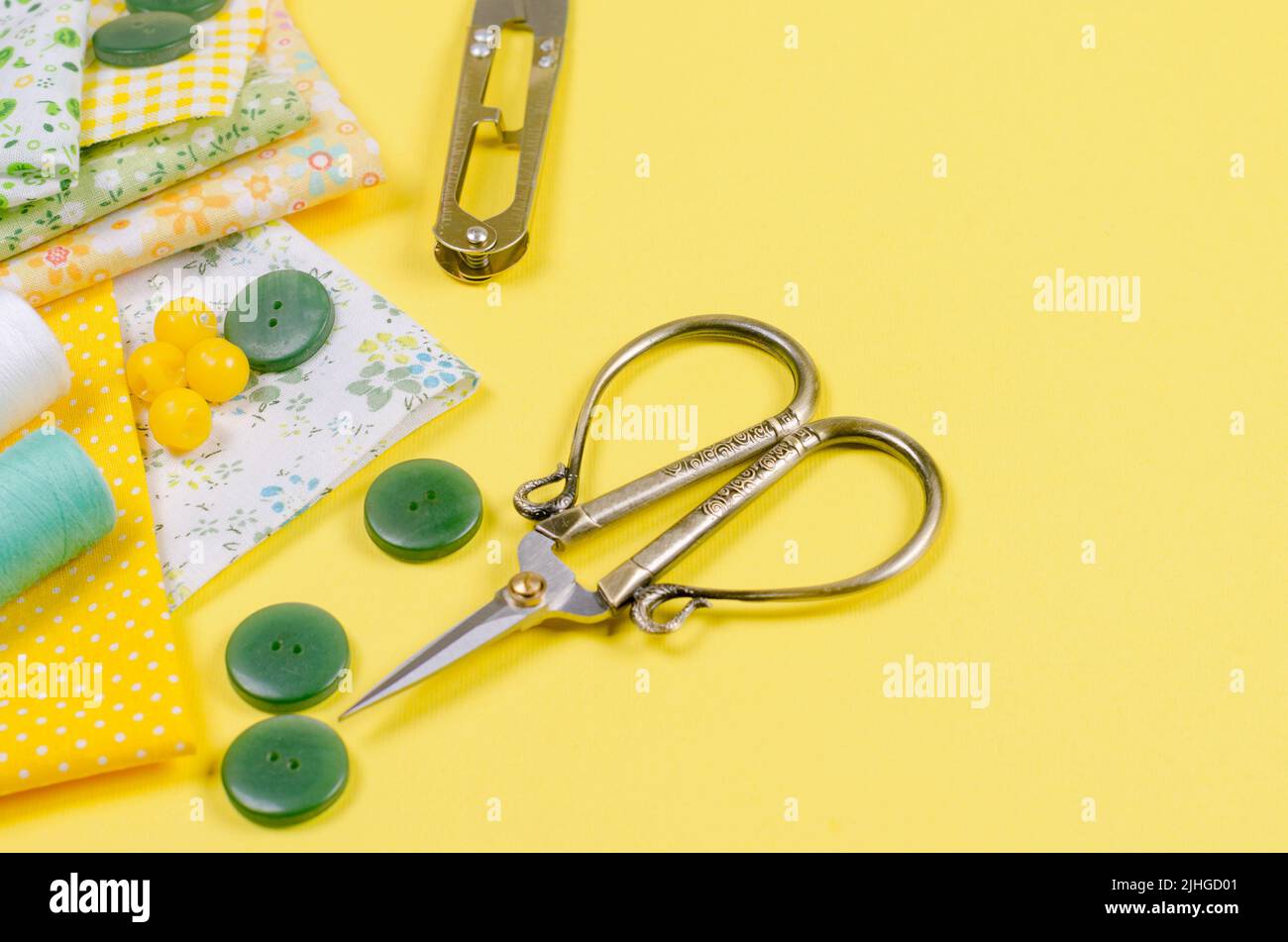 A set of sewing accessories for sewing, spools of thread, fabrics ...