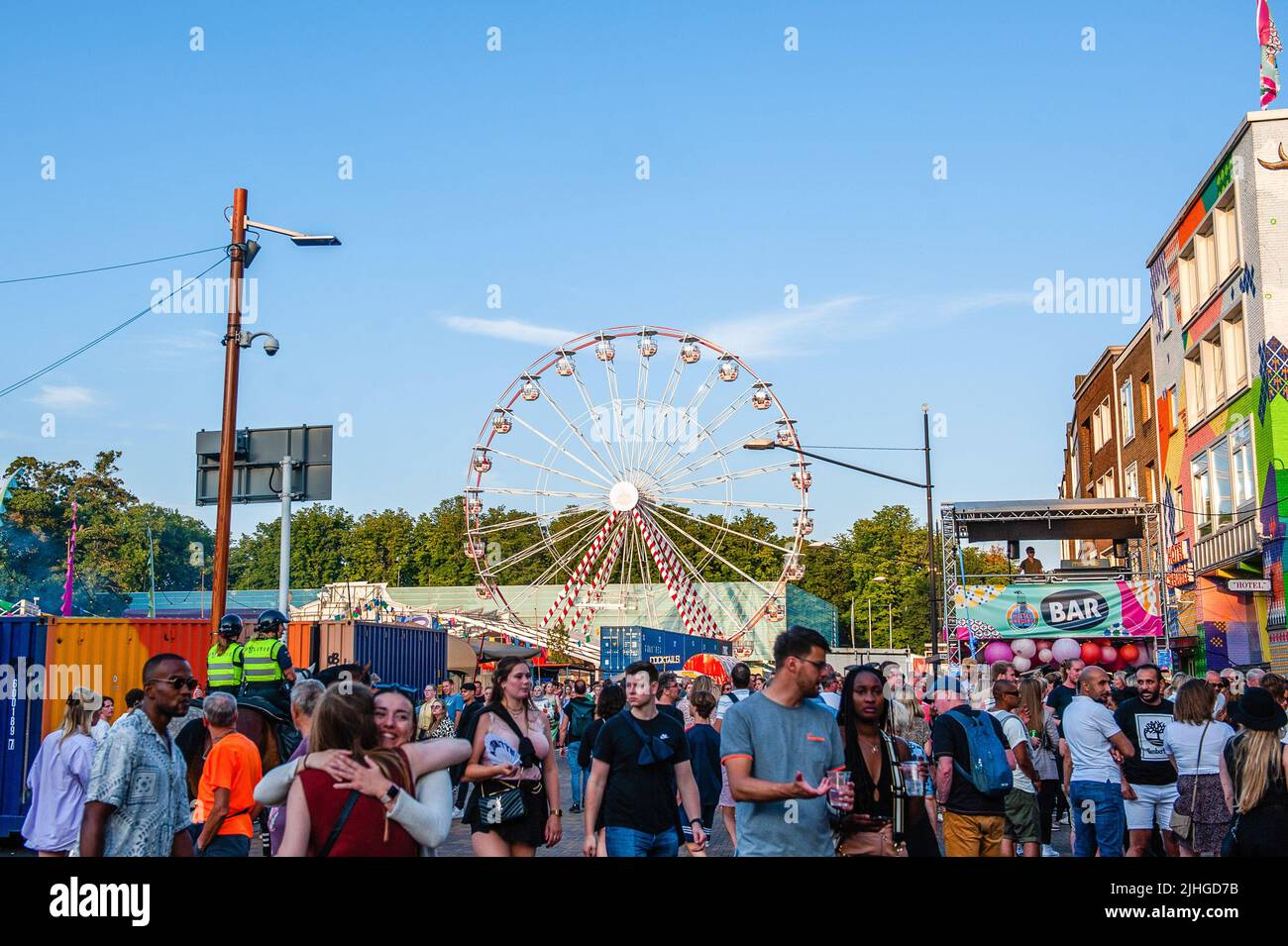 A Ferris wheel is seen placed in the middle of the city center during a  concert. The Vierdaagsefeesten (in English the meaning would be something  like The Four Days' party) is the