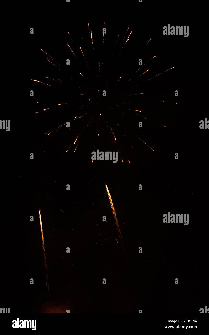slightly unfocused collection of fireworks against black background, can be used as an overlay Stock Photo