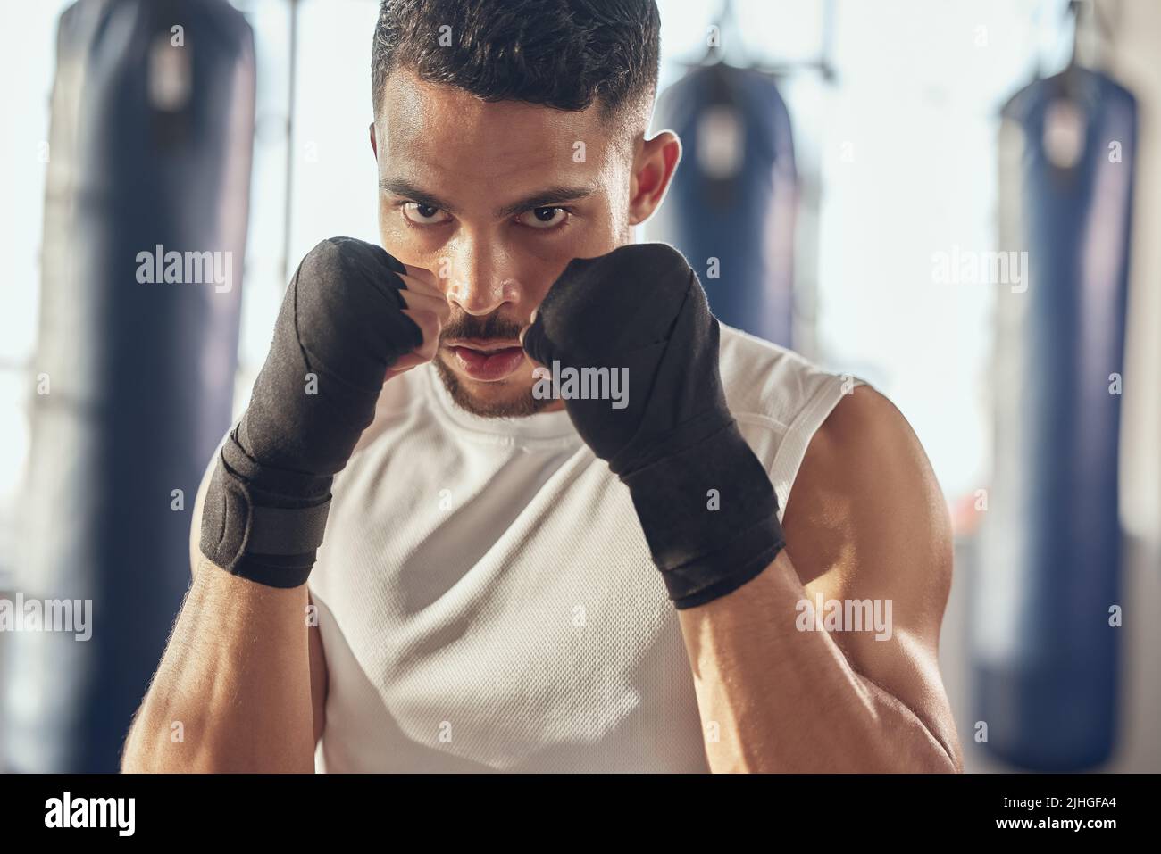Portrait of boxer ready for combat training. Closeup on face of combat