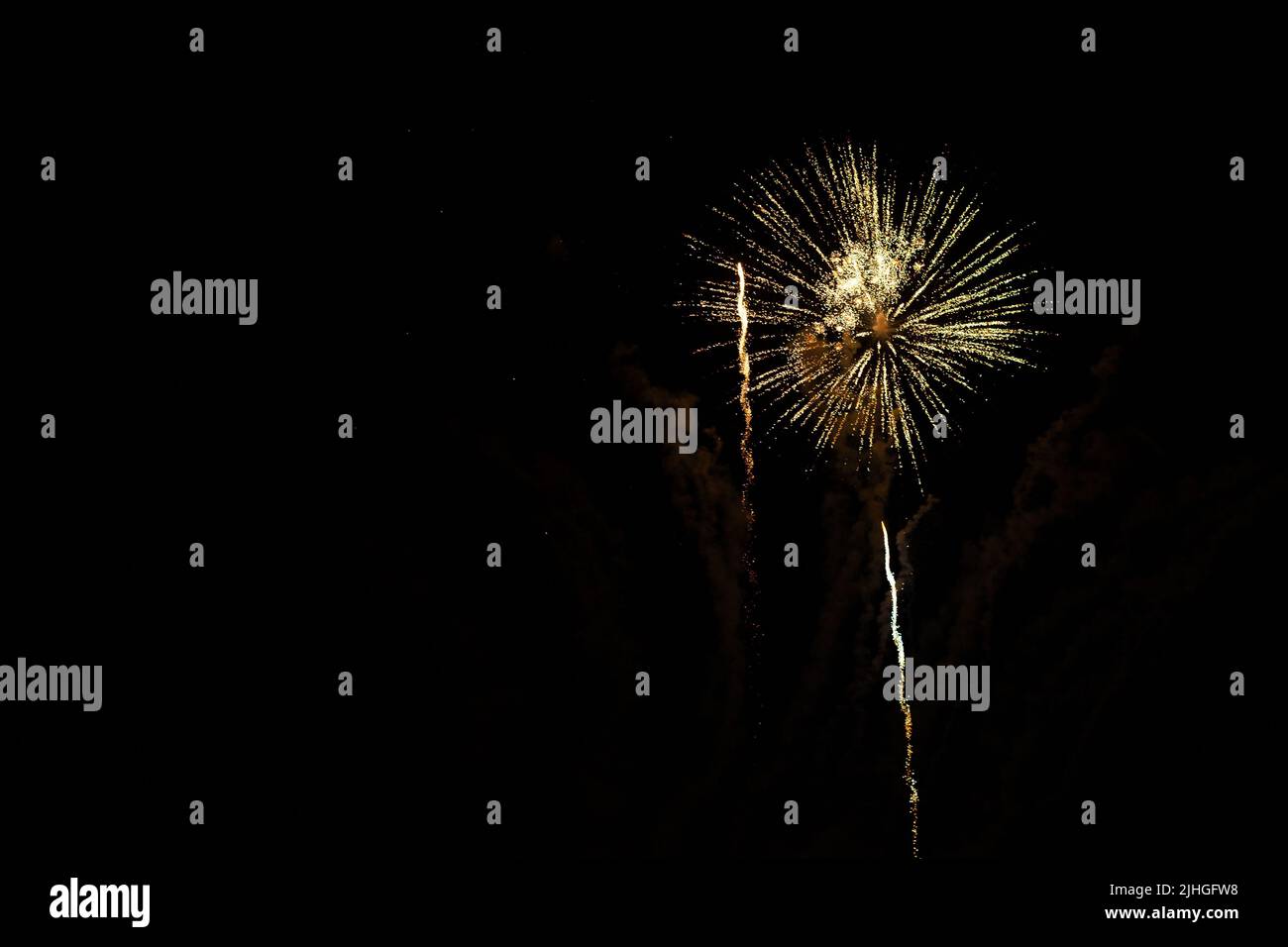 Loud fireworks exploding against black background, can be used as an