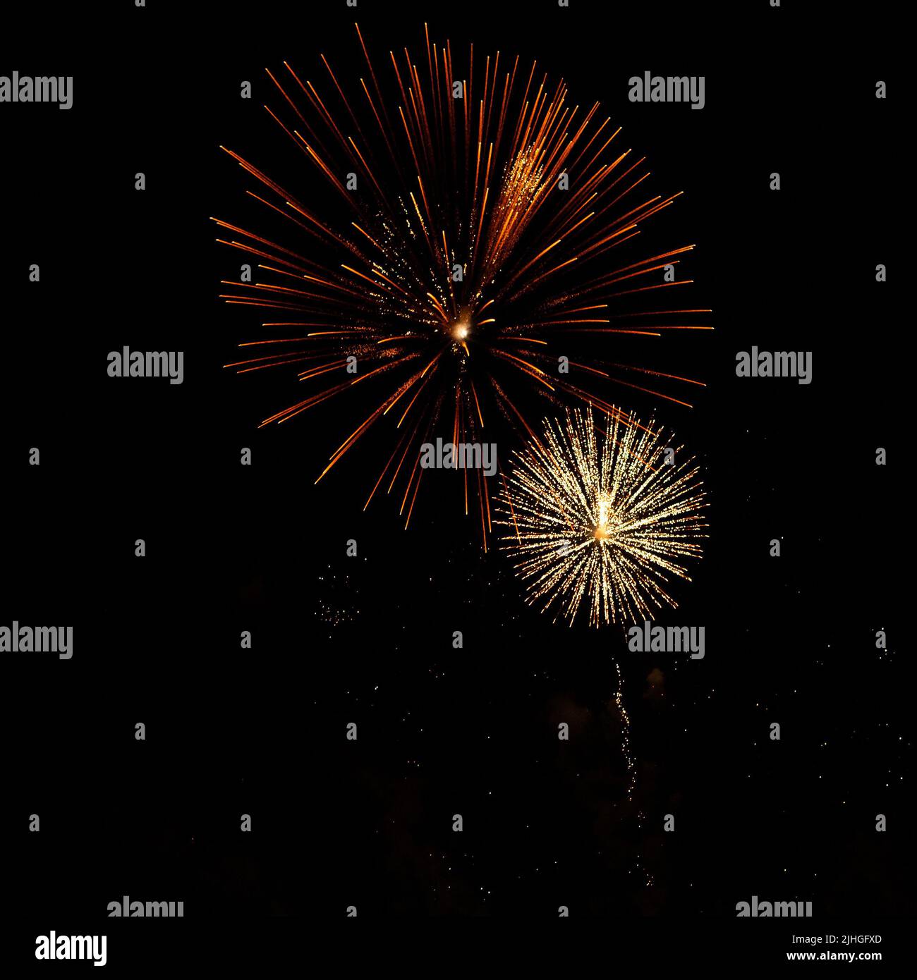 Bright fireworks with a sphere or circle shape exploding against black