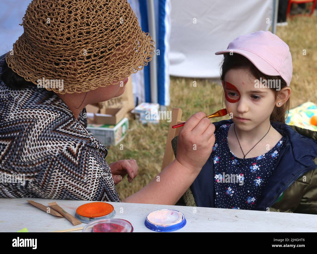 Cracow. Krakow. Poland. Open air fete for Ukraine refugees (mostly women and children) and their Polish hosts held in one of the city parks. Stock Photo