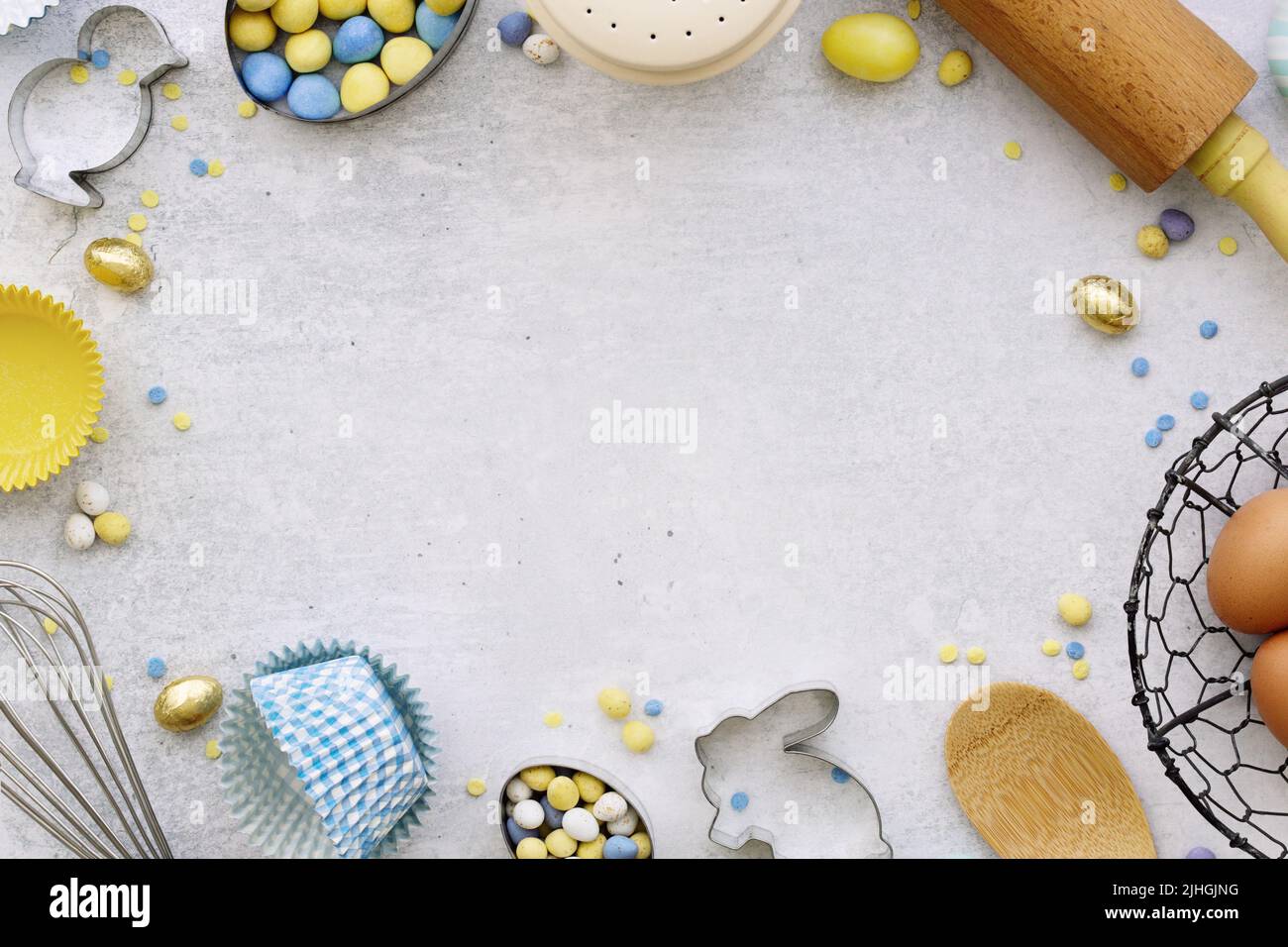 Easter baking background with Easter baking utensils and Easter eggs Stock Photo