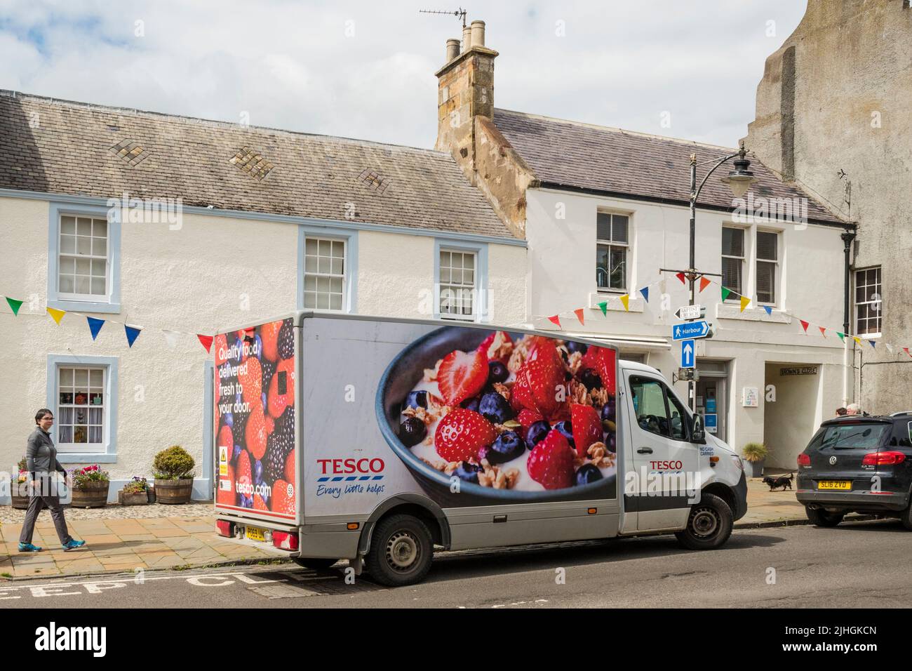 A Tesco delivery van delivering in the Fife village of Pittenweem. Stock Photo