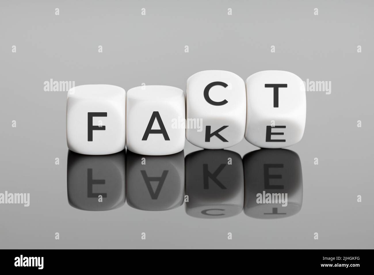 Fact or Fake concept. Flip blocks change the word fake to fact. April fools day Stock Photo
