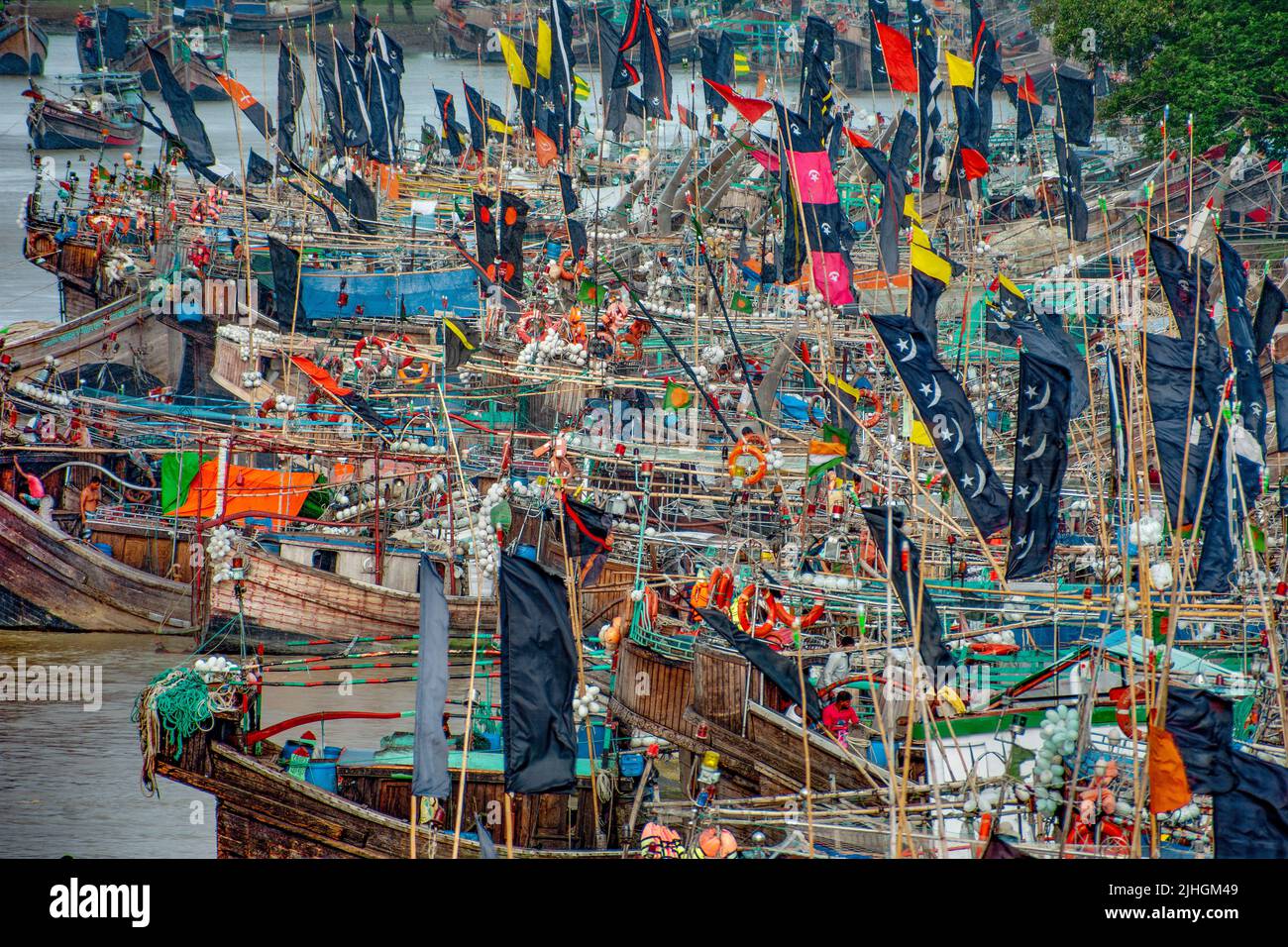 Fishing boats with colorful flags on them, Kuakata, Bangladesh Stock