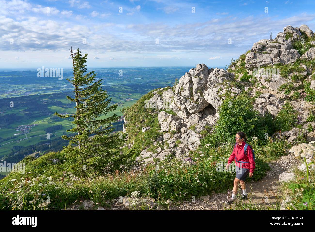 nice senior woman hiking at Mount Gruenten in the Allgaeu Alps with ...