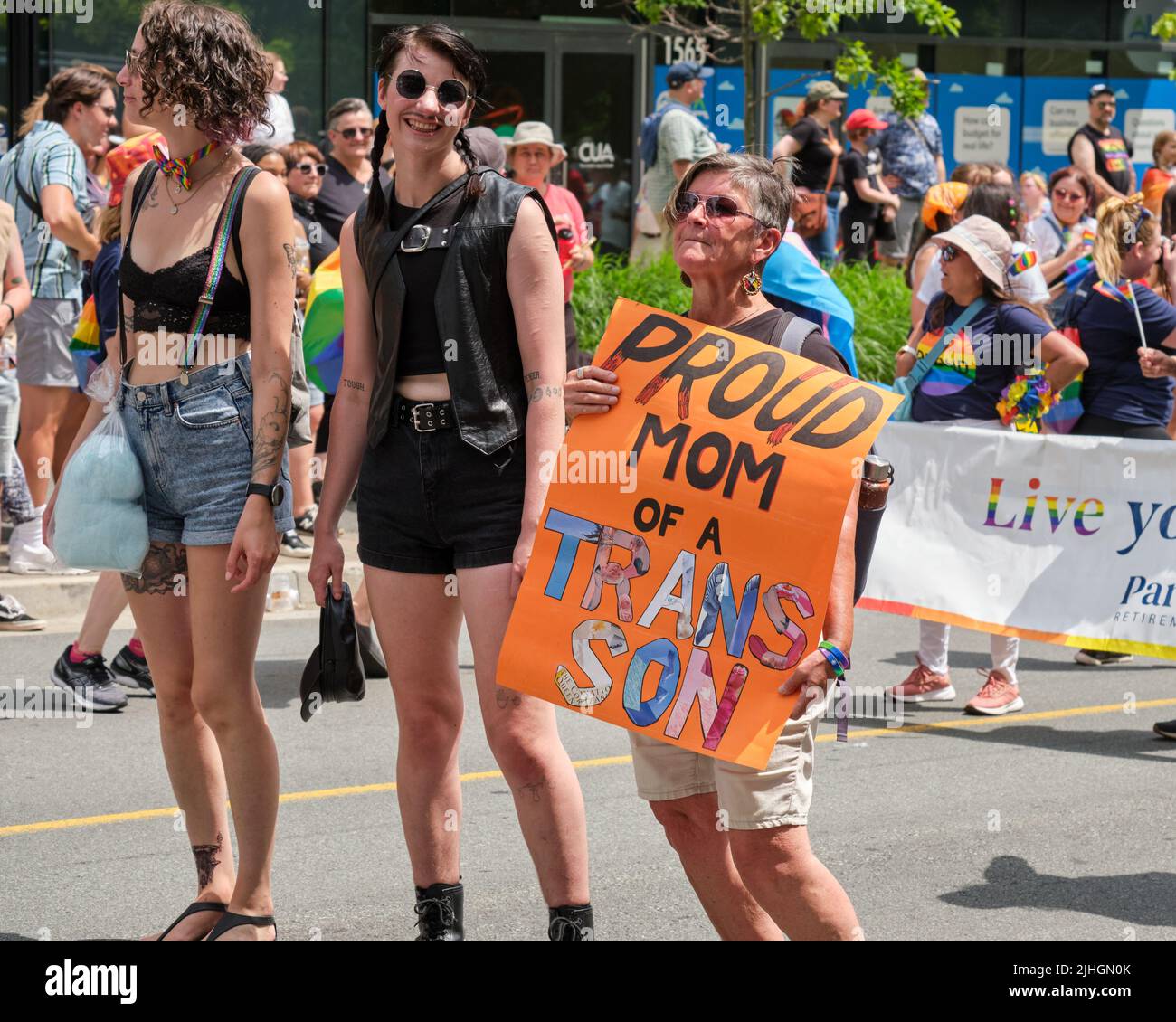 Halifax Pride Parade- Participant with sign 'Proud Mom to a Trans Son ' Stock Photo