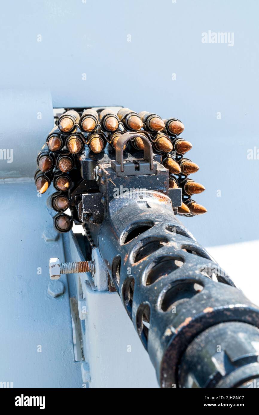 Close up of a cluster of 30 caliber ammunition, bullets, on top of a M1919 Browning machine gun on board the US Navy patrol boat, P22. Stock Photo