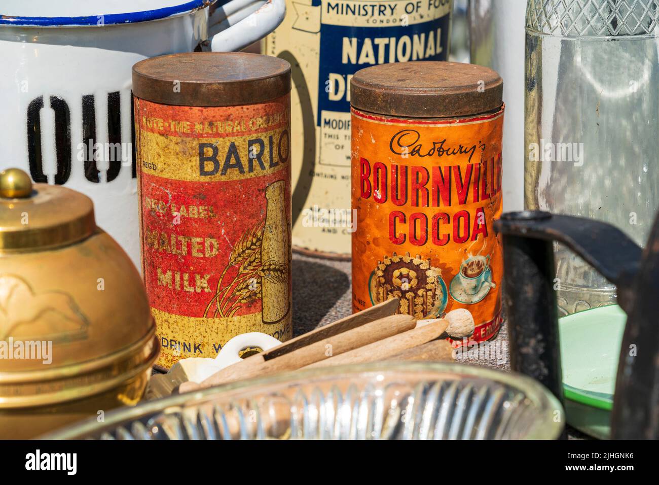 1940's tins of Malted Milk and Cadburys Bournville Cocoa on display with other food related items of nostalgia during a salute to the forties event. Stock Photo