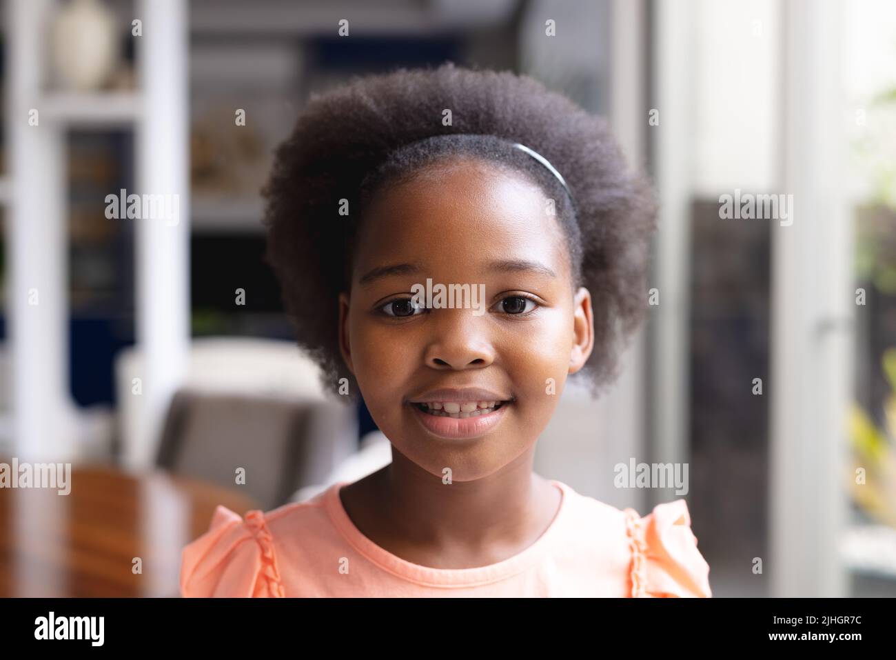 Image of happy african american girl looking at camera Stock Photo - Alamy