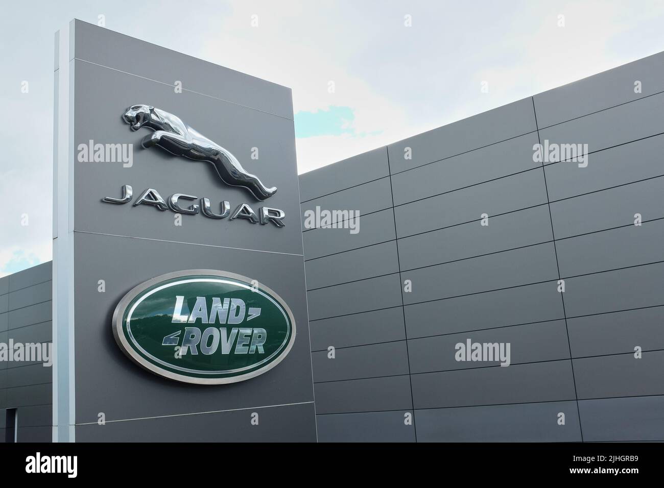 Kentdale Jaguar Land Rover garage with the Jaguar and Land Rover brand names and logos prominently displayed Stock Photo