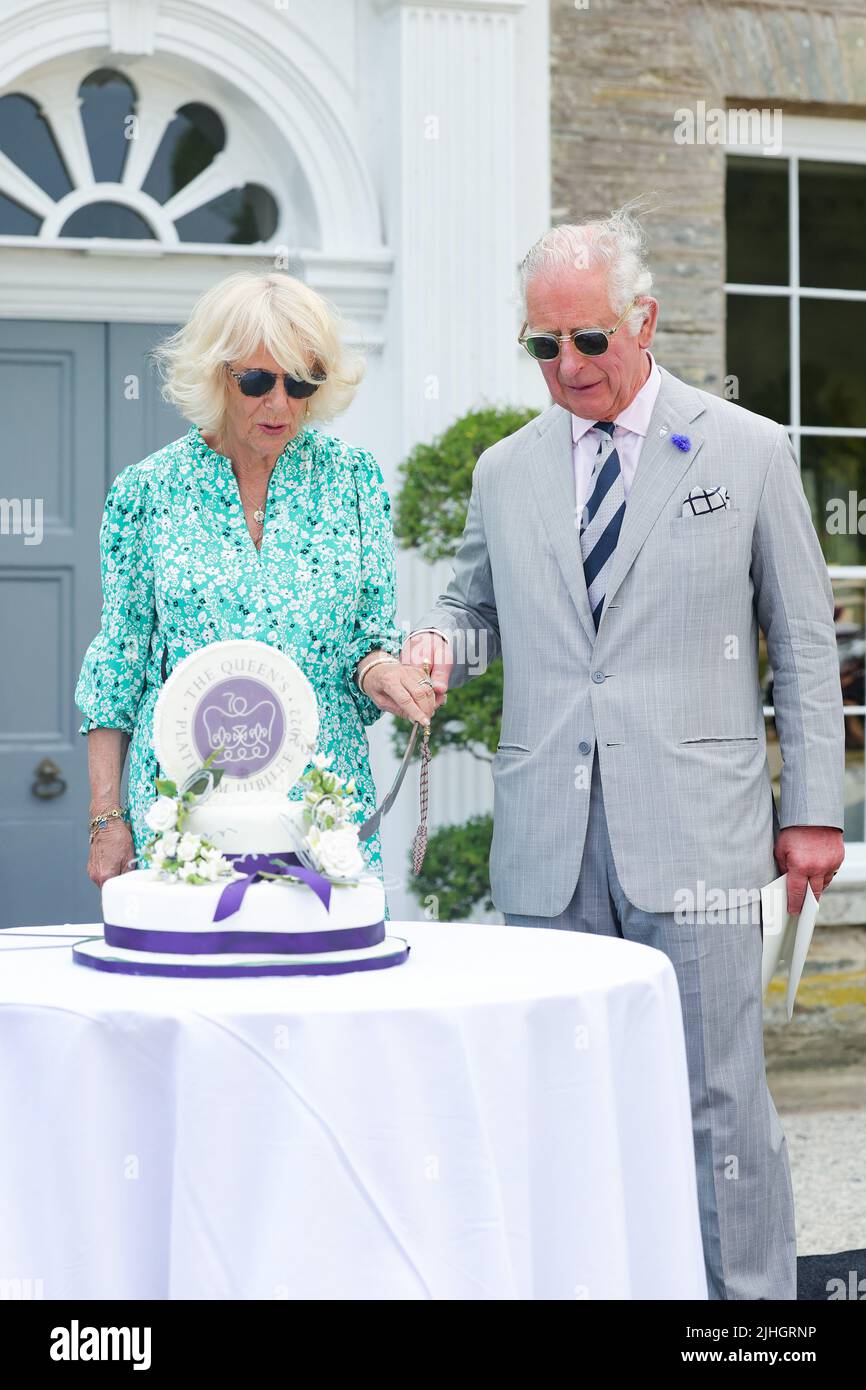 Britain's Prince Charles cuts a birthday cake during a visit to News  Photo - Getty Images