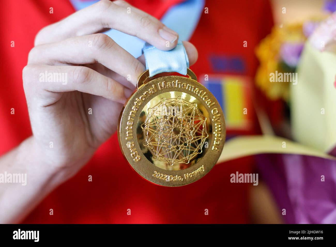 Otopeni, Romania - July 17, 2022: Details with a gold medal won at the 63rd International Mathematical Olympiad by a Romanian participant. Stock Photo