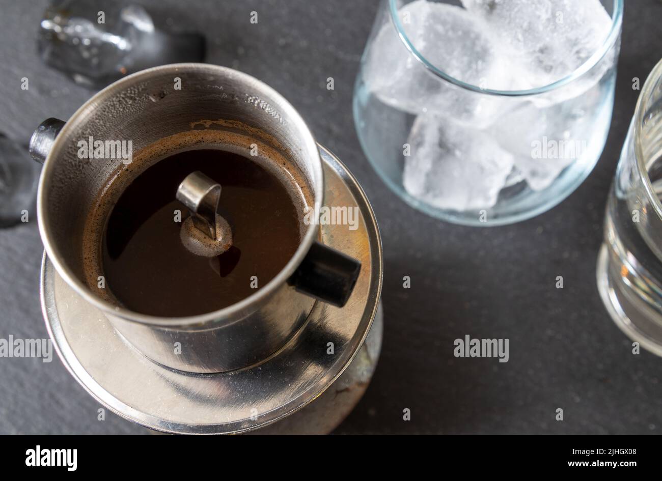 A traditional Vietnamese way of brewing coffee using a special filter
