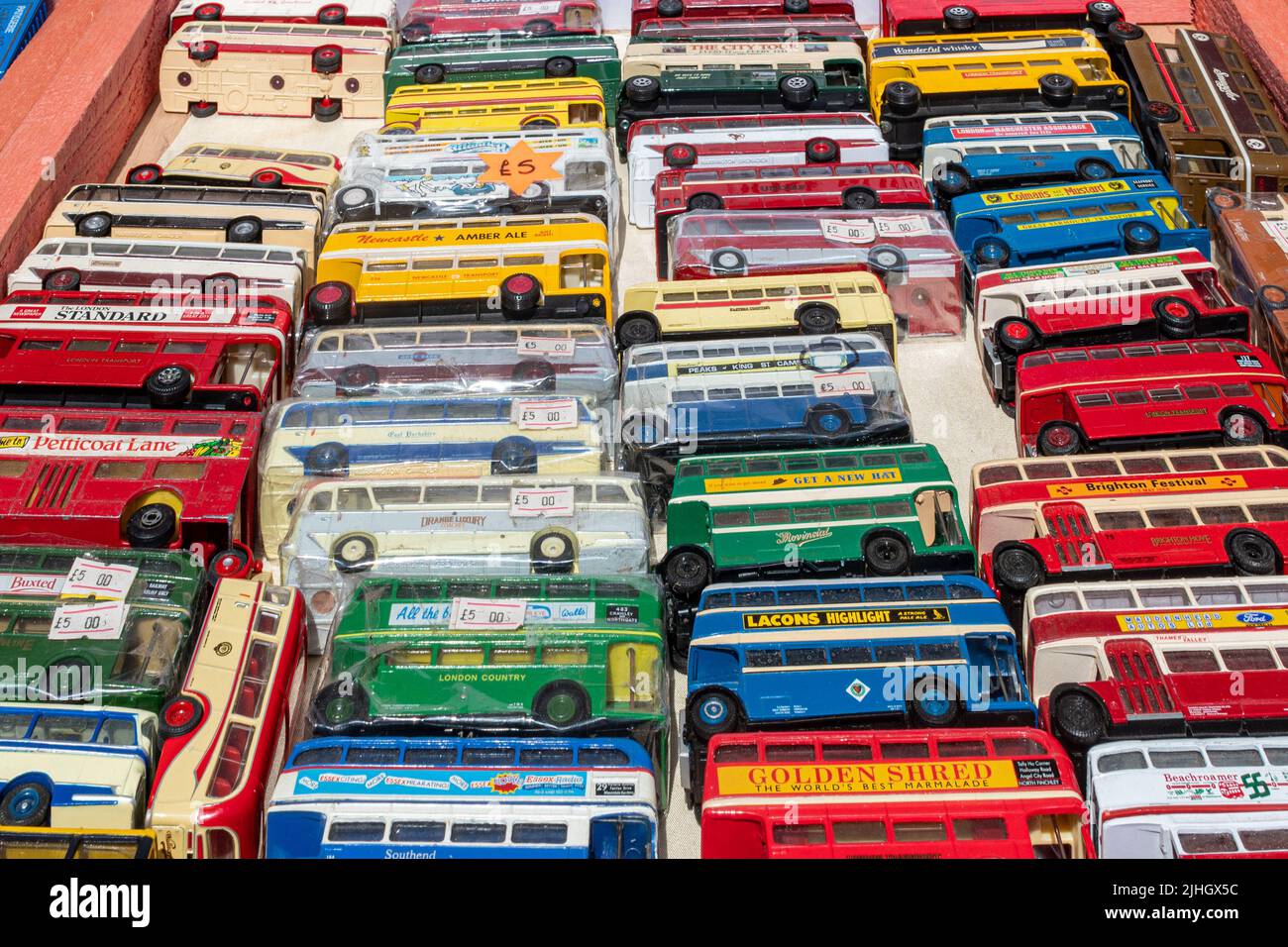 Toy buses, collectible models, on sale on a stall at a transport event, England, UK Stock Photo