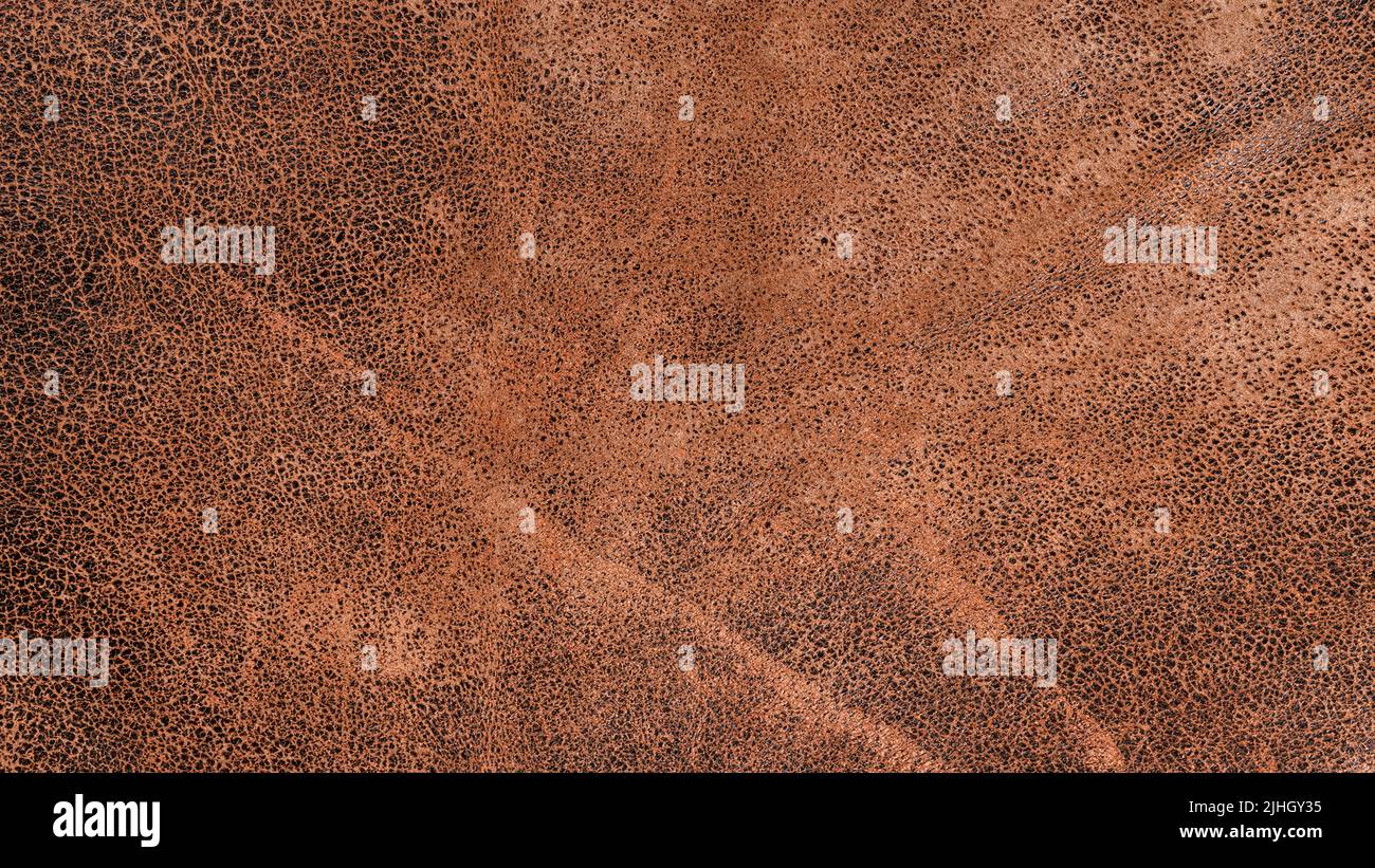 Weathered beige leather surface close up for texture and background Stock Photo