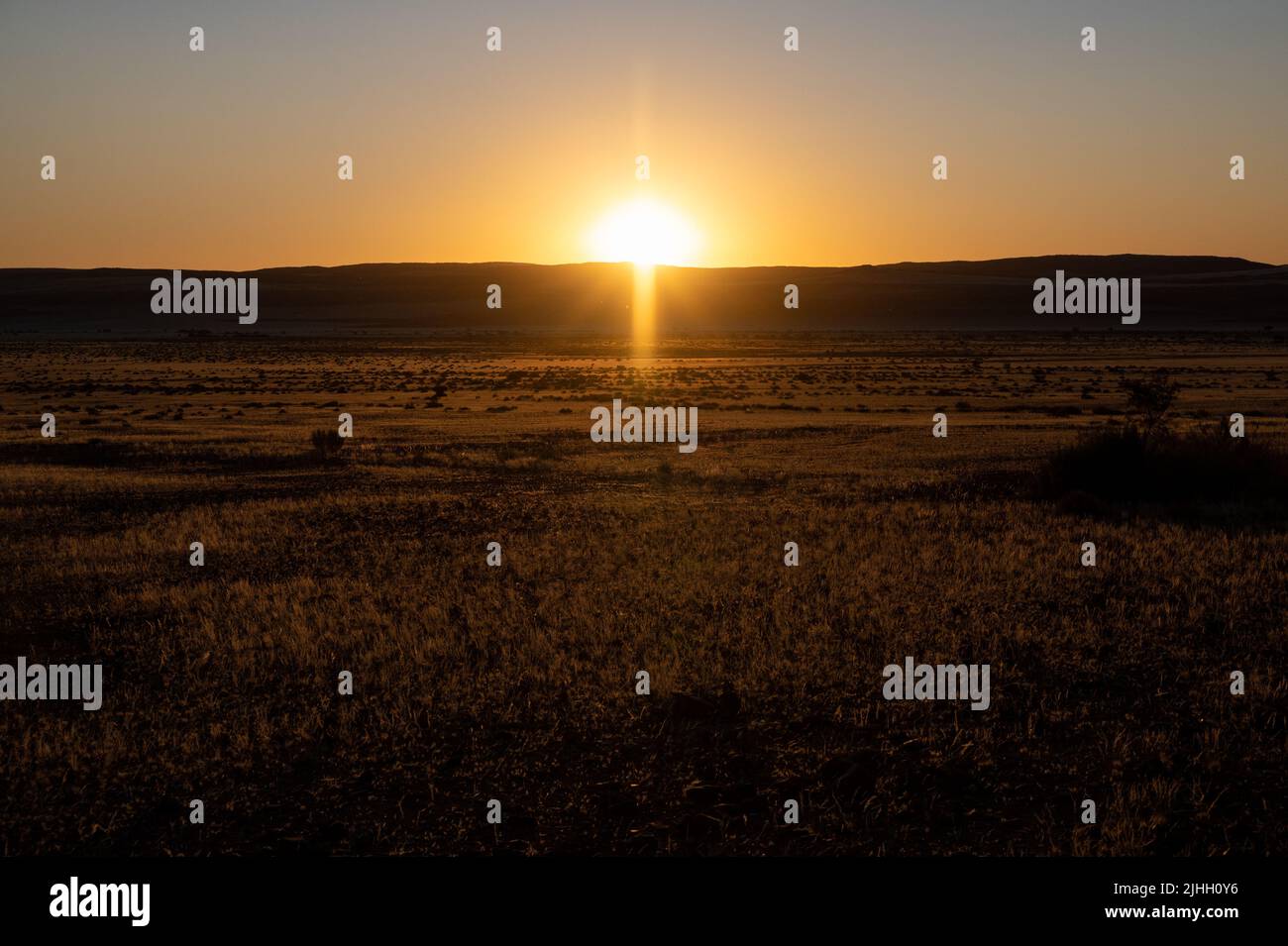 Beautiful sunset over the scenic kalahari-landscape in Namibia Stock Photo