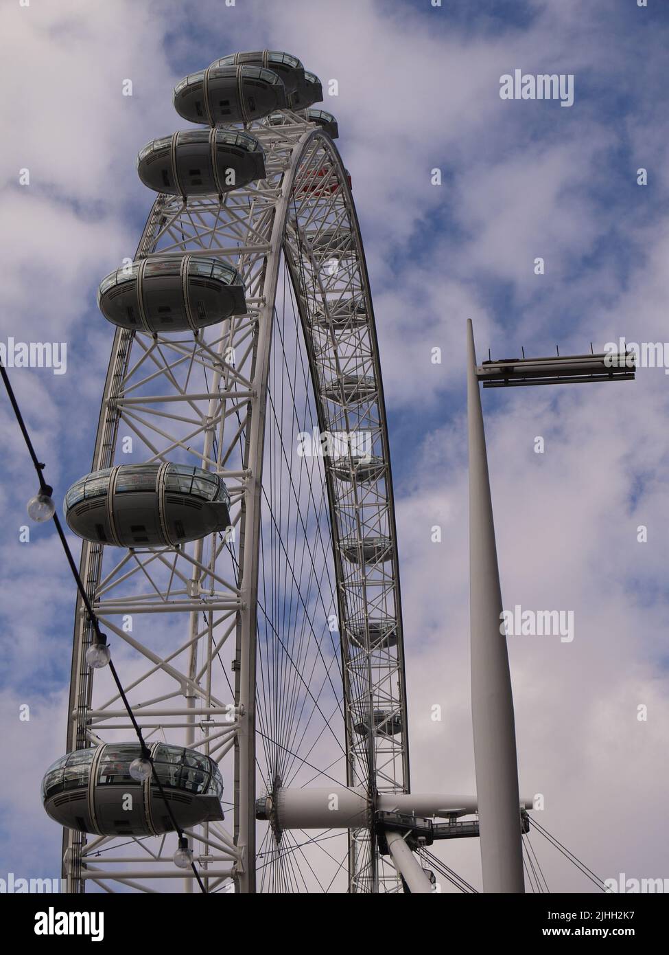 Vertical shot of The London Eye and its turning handle, London, UK Stock Photo