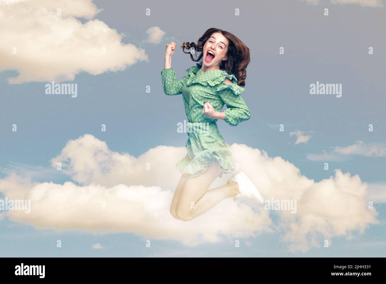 Happy girl jumping blue sky hi-res stock photography and images - Alamy