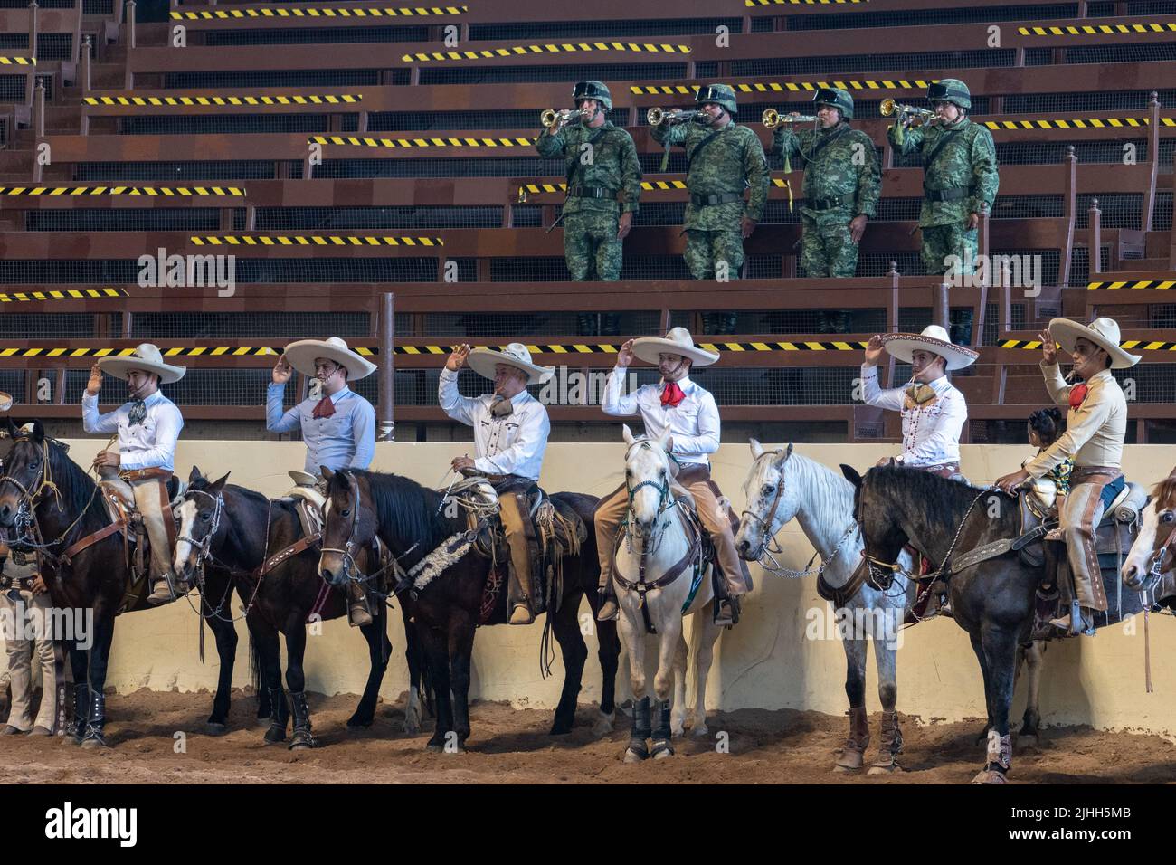 Anthem Rodeo Mexican soldiers play the national anthem as rodeo riders stand at ...
