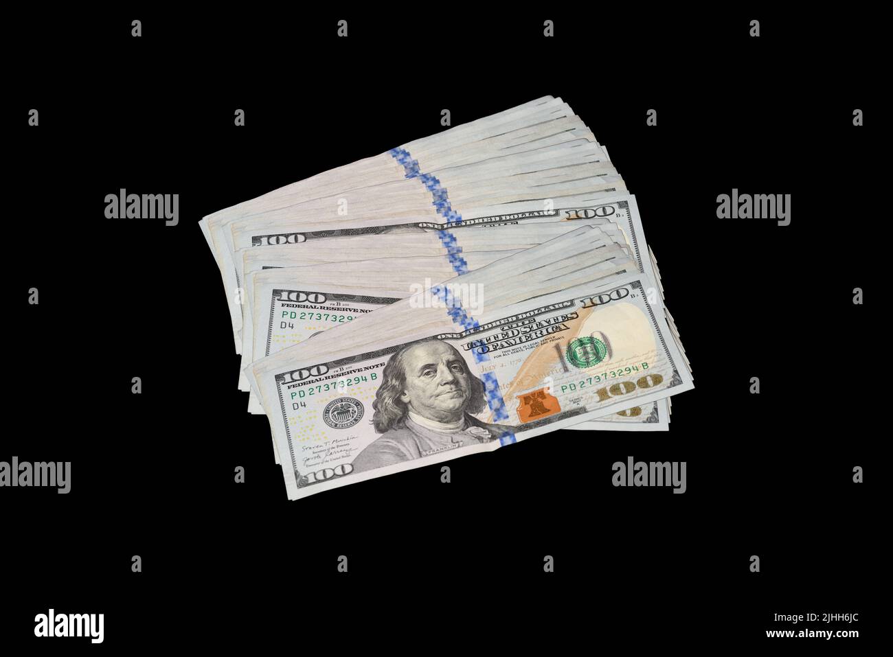100 Dollar Bills Fanned on Black Background Stock Photo