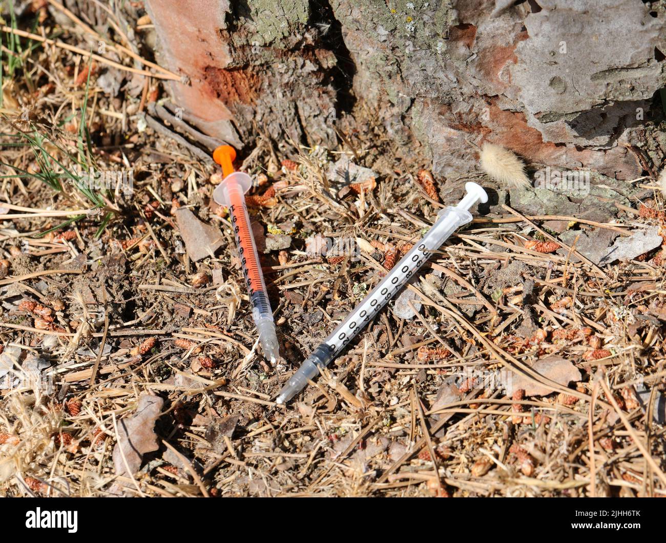 two syringes used by drug addicts to inject drugs abandoned in the