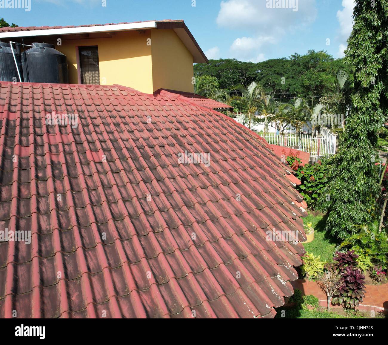 Black spots on red clay roof aerial drone view Stock Photo