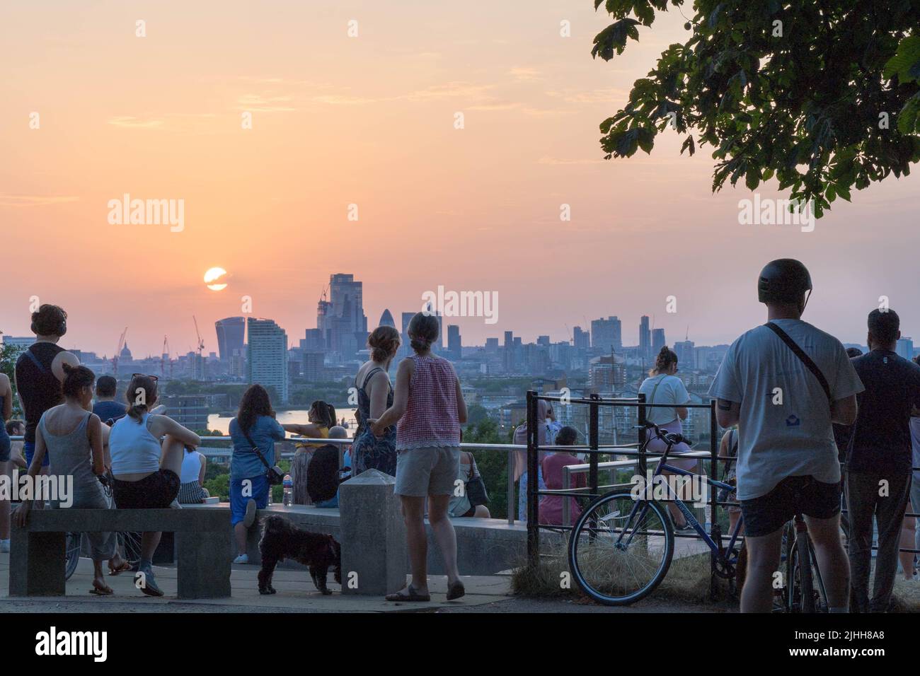 London UK, 18th July 2022.  UK Weather. People enjoy beautiful sunset on extremely hot summer Monday in London as UK prepares for Extreme heat national severe weather covering Monday and Tuesday  in England UK. Credit: Xiu Bao/Alamy Live News Stock Photo