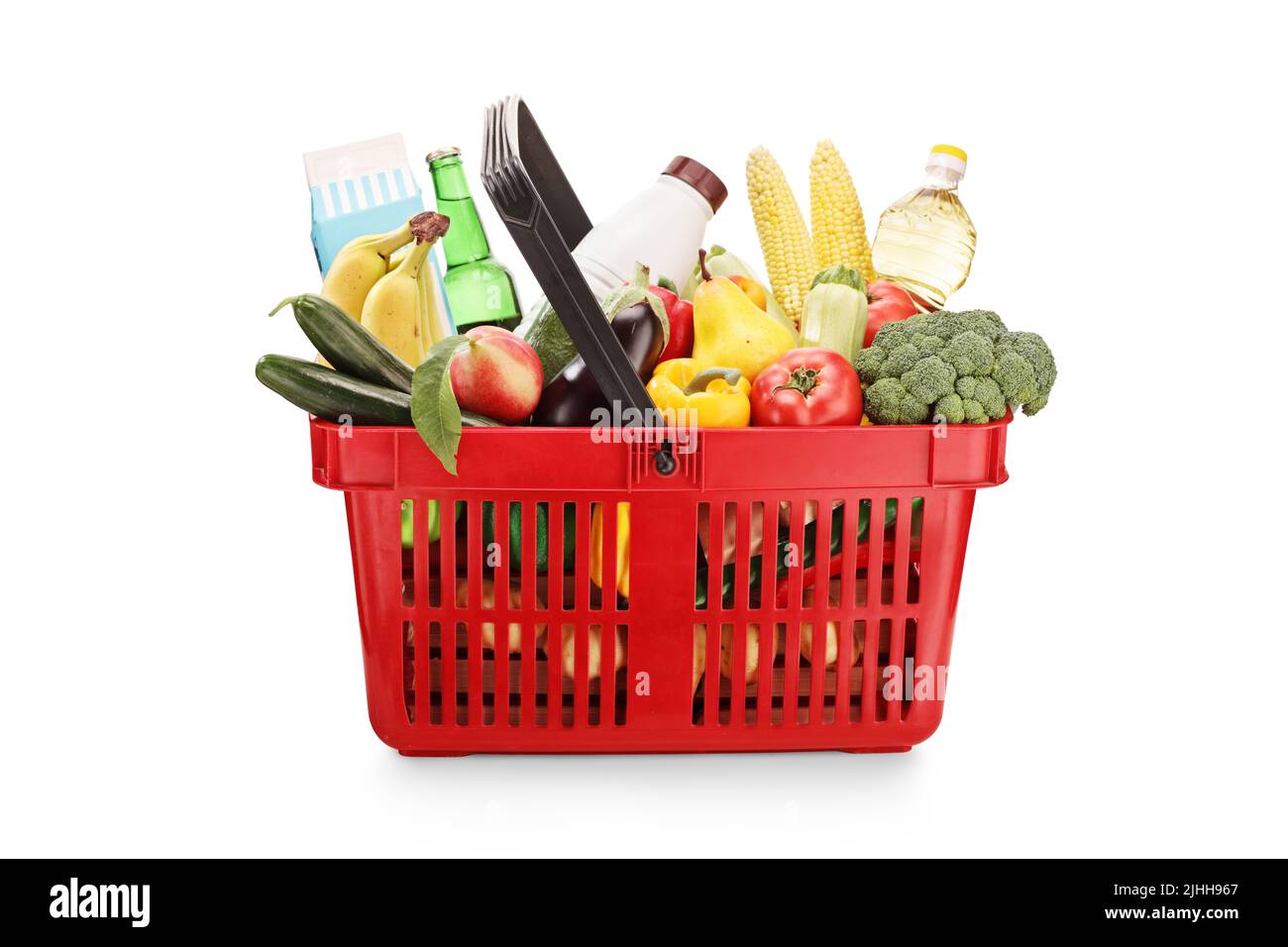 Red shopping basket full of products isolated on white background Stock