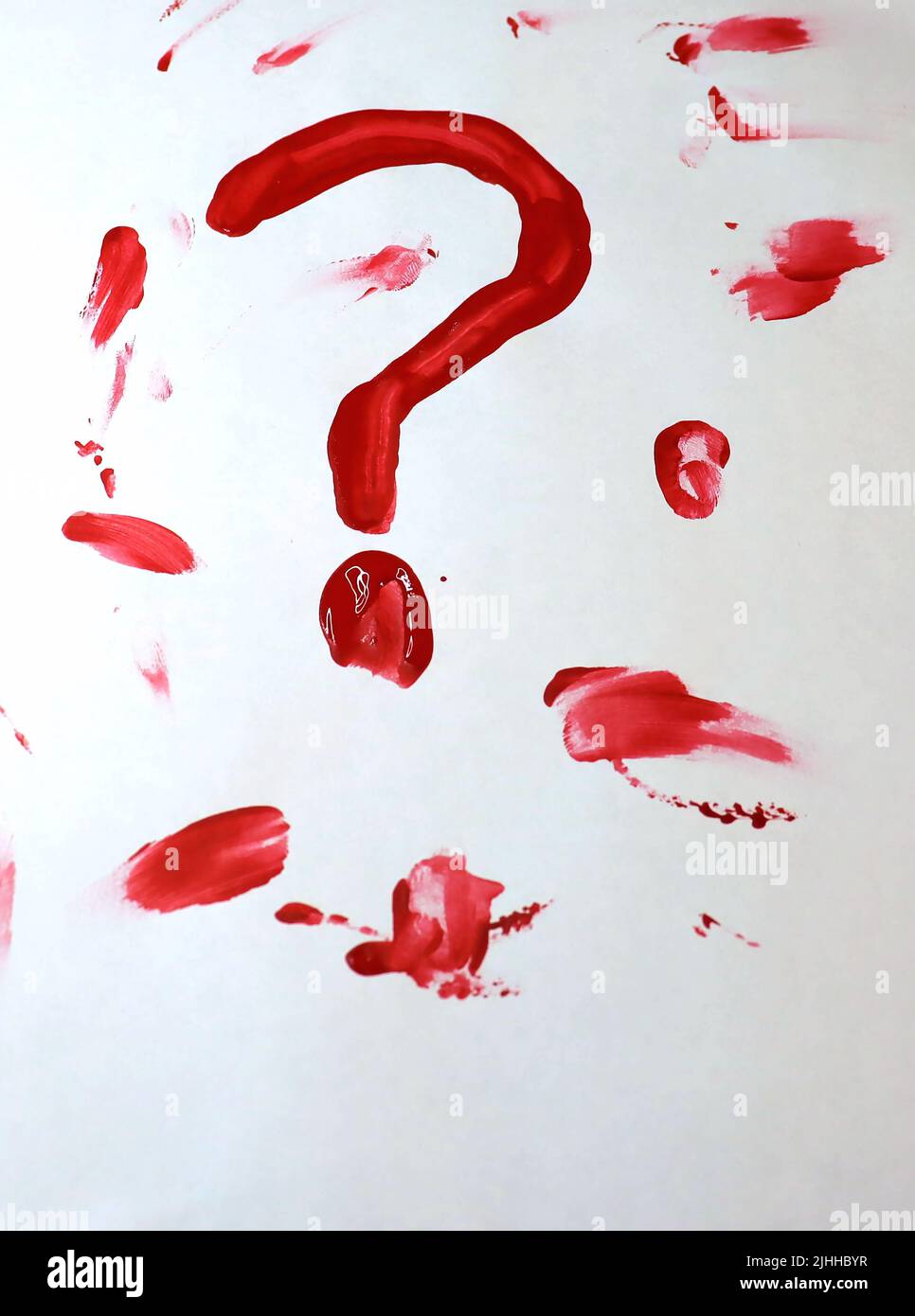 A blank piece of white paper with a bloody/paint question mark drawn amongst other blood smears. The blood/paint is still wet. Stock Photo