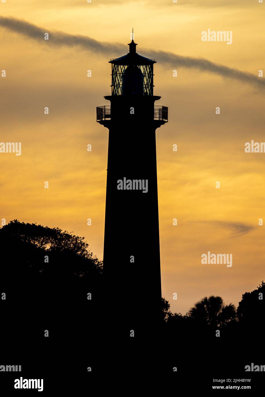 A beautiful Sunset over the lighthouse Stock Photo