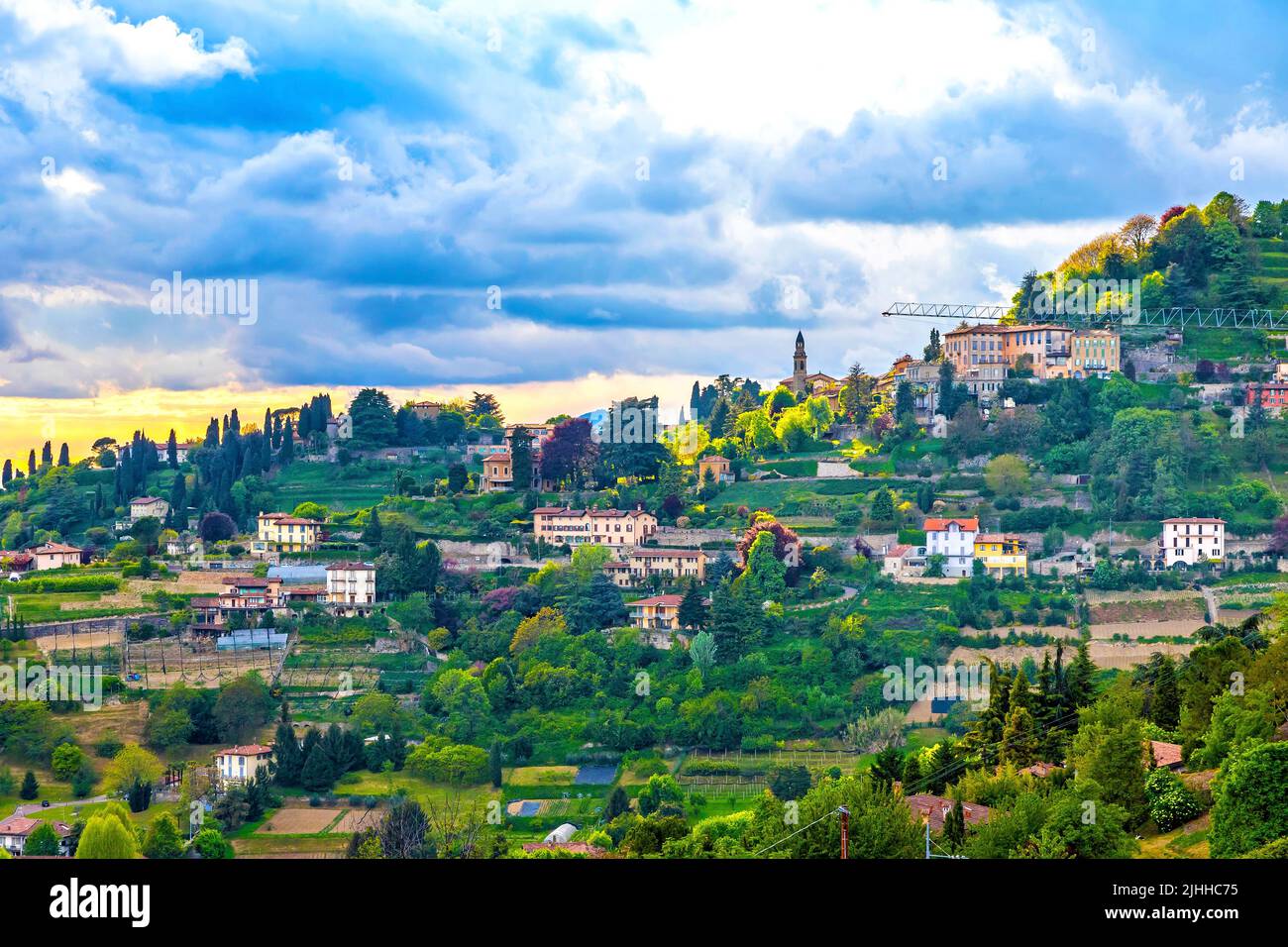 Picturesque aerial skyline spring view of outskirts of Bergamo city, Lombardy province, Italy. View from Parco di San Giovanni Stock Photo